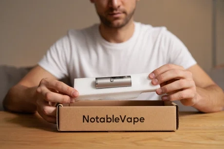 Happy customer unboxing an order from an online vapes Australia store